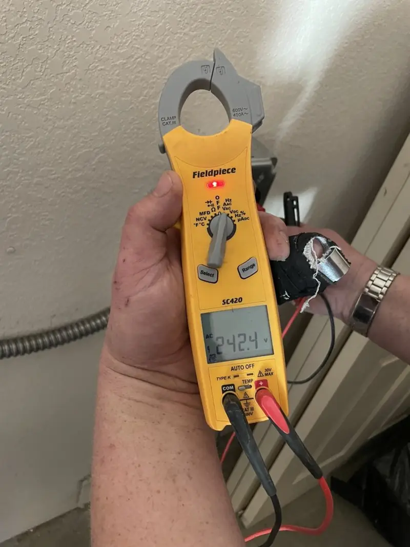 Voltage testing with clamp meter during Electrical Installation Services in Millersville